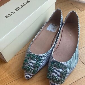 All Black flats striped black/white green buckle